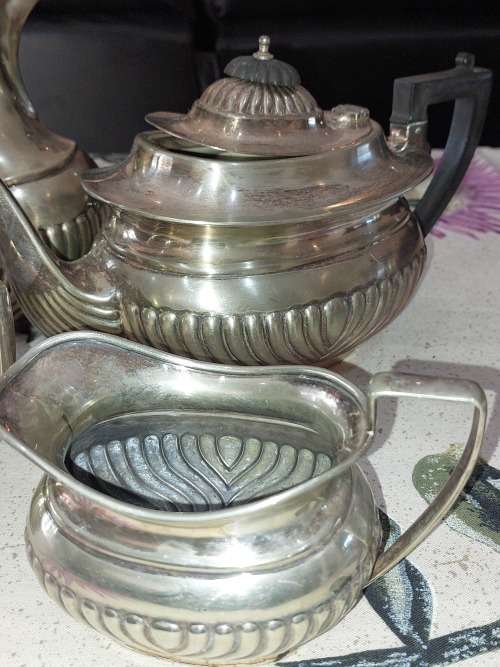 AN ANTIQUE EPNS TEA JUG SET SOLD AS IS