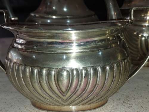 AN ANTIQUE EPNS TEA JUG SET SOLD AS IS