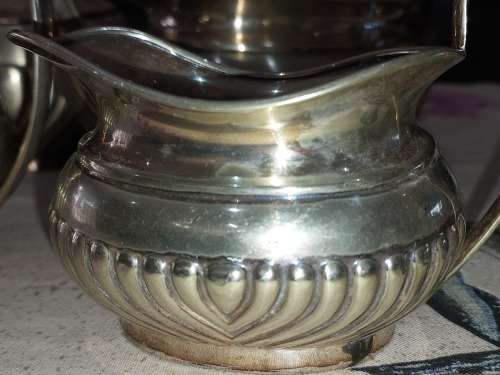 AN ANTIQUE EPNS TEA JUG SET SOLD AS IS
