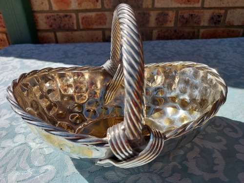 A VINTAGE ART DECOR SILVER PLATED ON BRASS SERVING BASKET SOLD AS IS