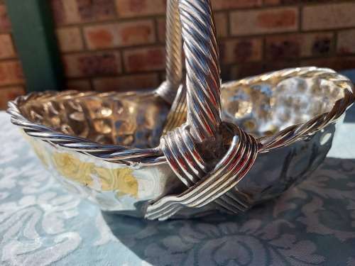 A VINTAGE ART DECOR SILVER PLATED ON BRASS SERVING BASKET SOLD AS IS