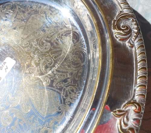 A VICTORIAN STYLE SILVER PLATED SERVING TRAY SOLD AS IS