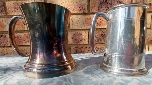 TWO BEER MUGS A SILVER PLATED AND A PEWTER MUG SOLD AS IS