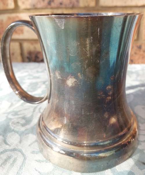 TWO BEER MUGS A SILVER PLATED AND A PEWTER MUG SOLD AS IS