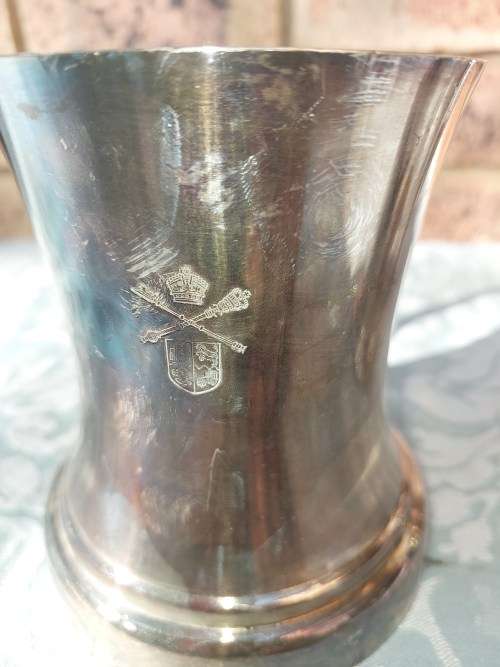 TWO BEER MUGS A SILVER PLATED AND A PEWTER MUG SOLD AS IS