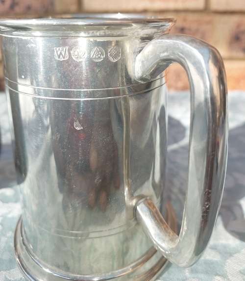 TWO BEER MUGS A SILVER PLATED AND A PEWTER MUG SOLD AS IS