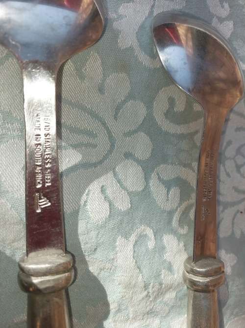 AN ART DECOR PAIR OF ALUMINUM ALLOY HANDLED SALAD TONGS SOLD AS IS