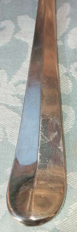 A CLASSIC DESIGNED PAIR OF SALAD TONGS SOLD AS IS