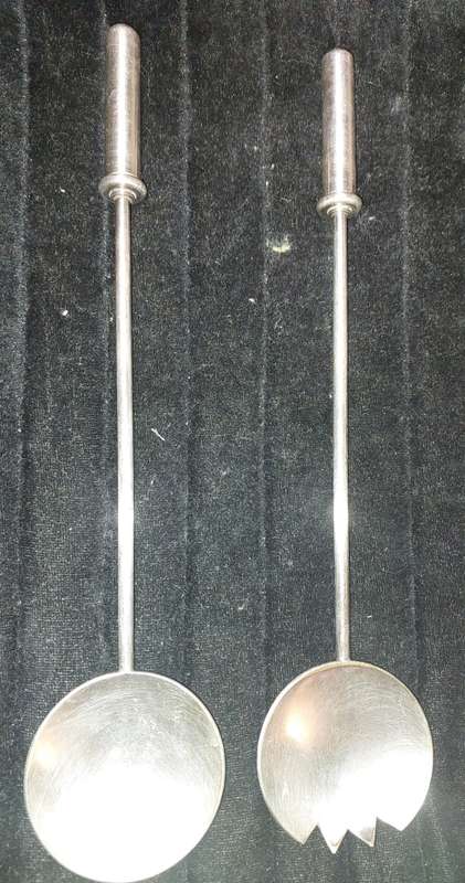 A PAIR STAINLESS STEEL SALAD LADELS SOLD AS IS