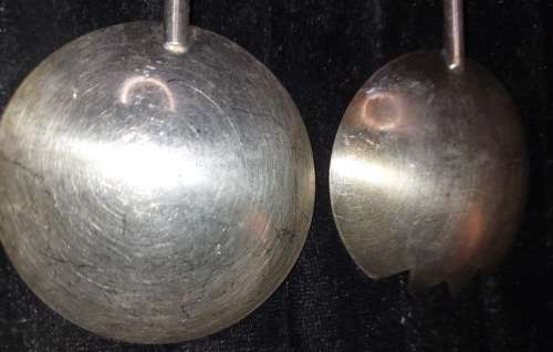 A PAIR STAINLESS STEEL SALAD LADELS SOLD AS IS