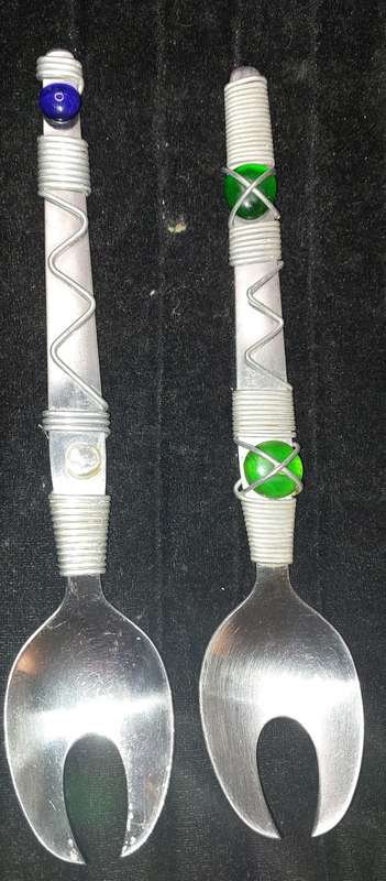 A PAIR STAINLESS STEEL SALAD LADELS SOLD AS IS