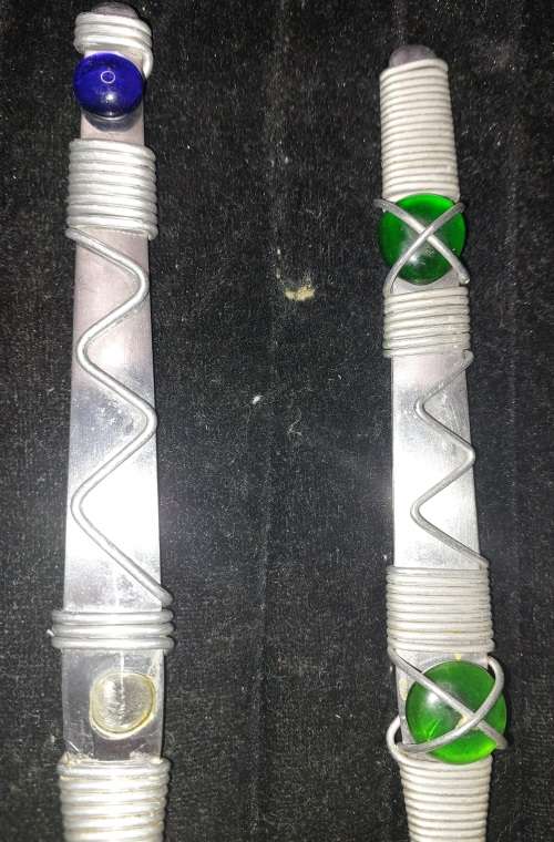 A PAIR STAINLESS STEEL SALAD LADELS SOLD AS IS