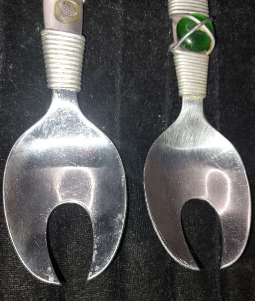 A PAIR STAINLESS STEEL SALAD LADELS SOLD AS IS