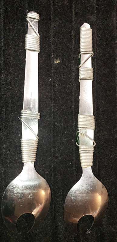 A PAIR STAINLESS STEEL SALAD LADELS SOLD AS IS