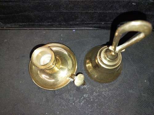 A SOLID HEAVY BRASS CANDLE STAND AND SOLID BRASS BELL