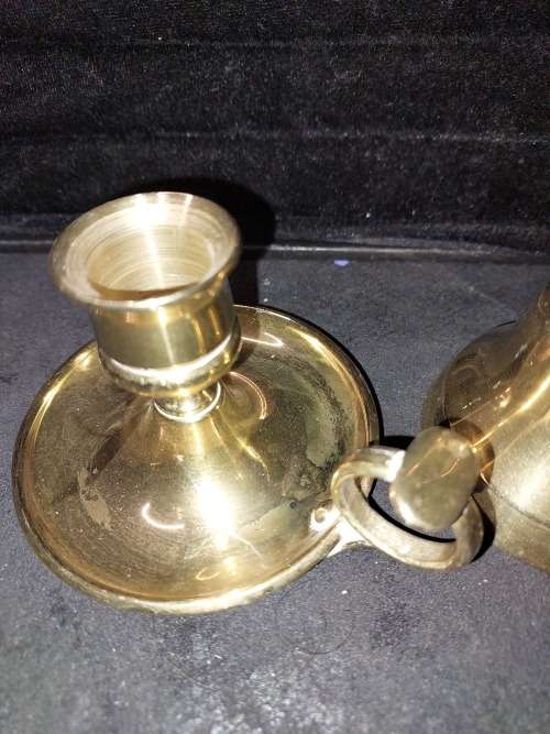 A SOLID HEAVY BRASS CANDLE STAND AND SOLID BRASS BELL