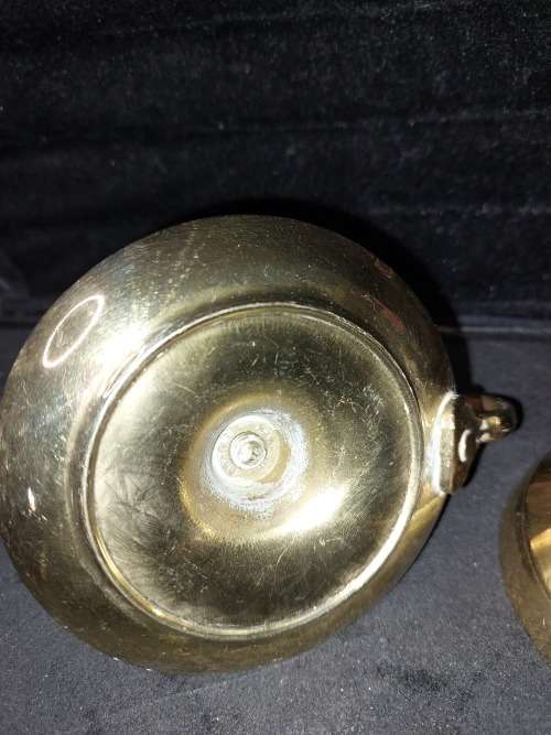 A SOLID HEAVY BRASS CANDLE STAND AND SOLID BRASS BELL