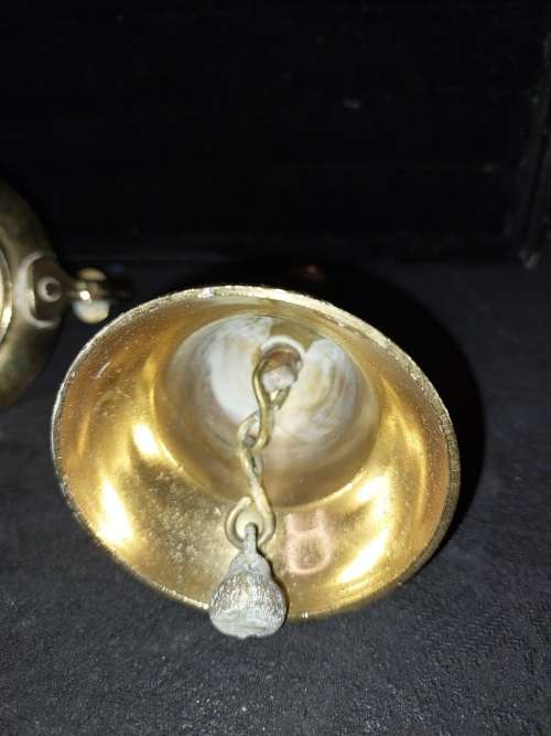 A SOLID HEAVY BRASS CANDLE STAND AND SOLID BRASS BELL