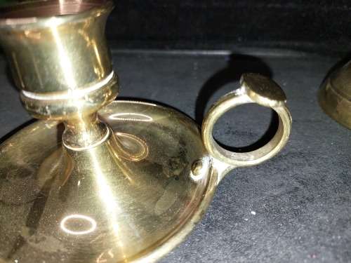 A SOLID HEAVY BRASS CANDLE STAND AND SOLID BRASS BELL