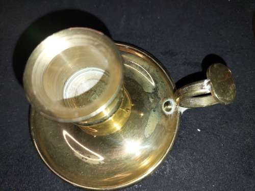 A SOLID HEAVY BRASS CANDLE STAND AND SOLID BRASS BELL