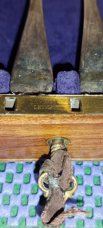 AN ANTIQUE HALL MARKED FISH KNIFE AND FORK SET COMPLETE IN ITS ORIGINAL CASE
