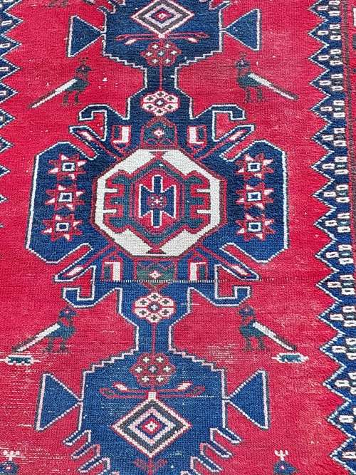 A VINTAGE MULTI-COLOURED PERSIAN RUG