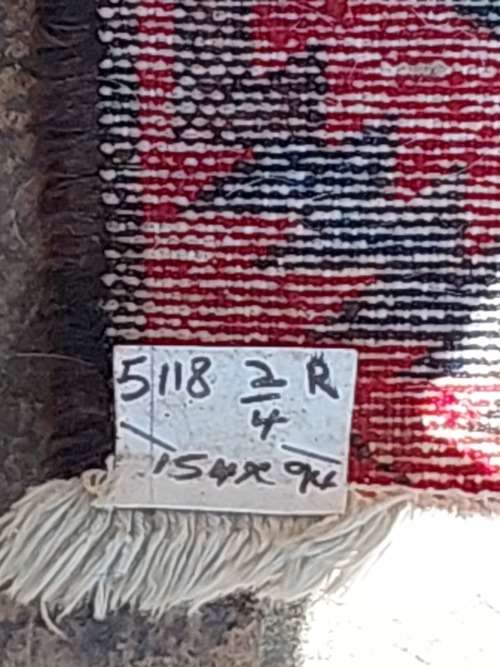 A VINTAGE MULTI-COLOURED PERSIAN RUG