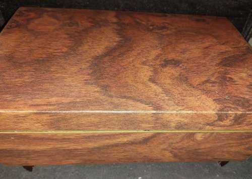 A VINTAGE BURLE WOODEN MUSICAL JEWELRY BOX WITH RED VELVET SOLD AS IS