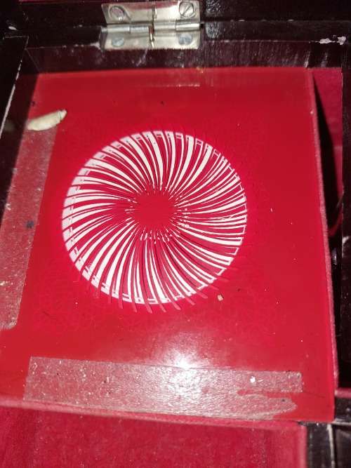 A VINTAGE BURLE WOODEN MUSICAL JEWELRY BOX WITH RED VELVET SOLD AS IS