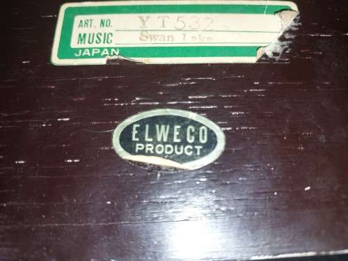A VINTAGE BURLE WOODEN MUSICAL JEWELRY BOX WITH RED VELVET SOLD AS IS
