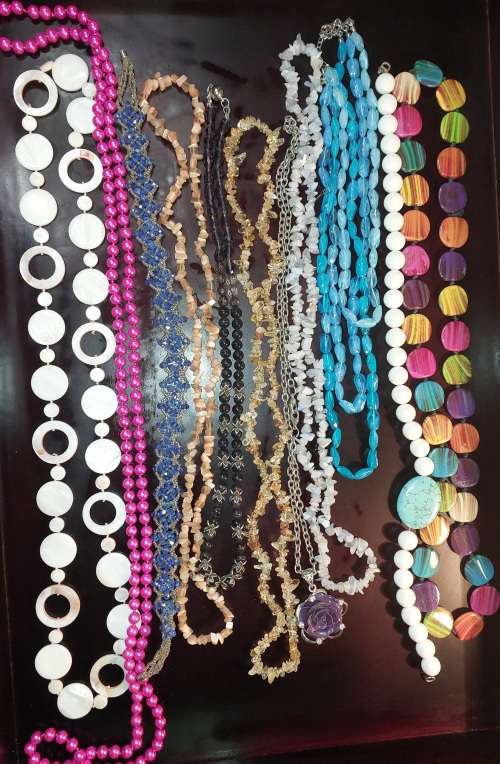A COLLECTION OF SYNTHETIC BEAD COSTUME NECKLACES
