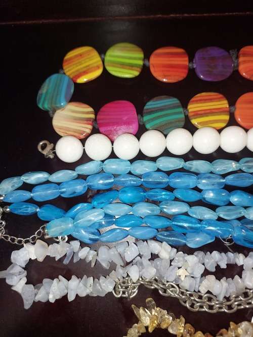 A COLLECTION OF SYNTHETIC BEAD COSTUME NECKLACES