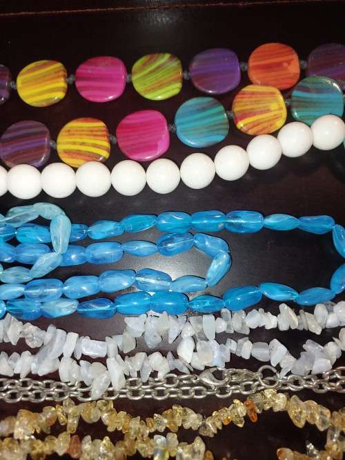 A COLLECTION OF SYNTHETIC BEAD COSTUME NECKLACES