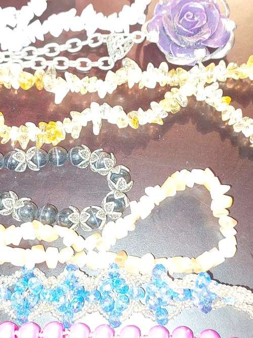 A COLLECTION OF SYNTHETIC BEAD COSTUME NECKLACES
