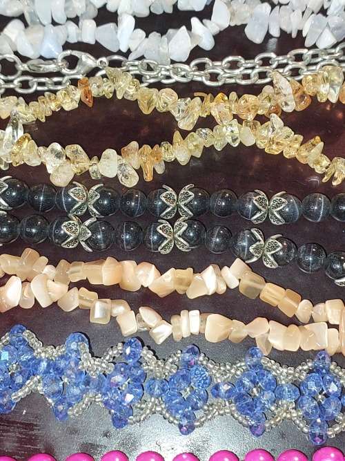 A COLLECTION OF SYNTHETIC BEAD COSTUME NECKLACES