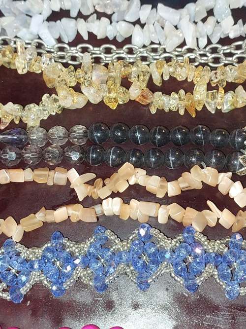 A COLLECTION OF SYNTHETIC BEAD COSTUME NECKLACES
