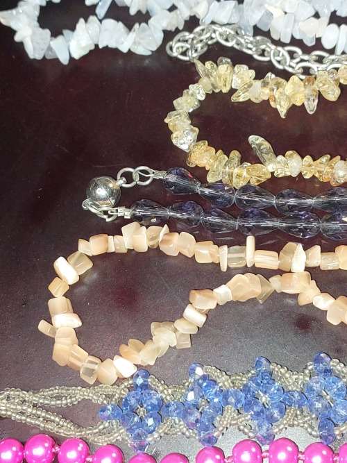 A COLLECTION OF SYNTHETIC BEAD COSTUME NECKLACES