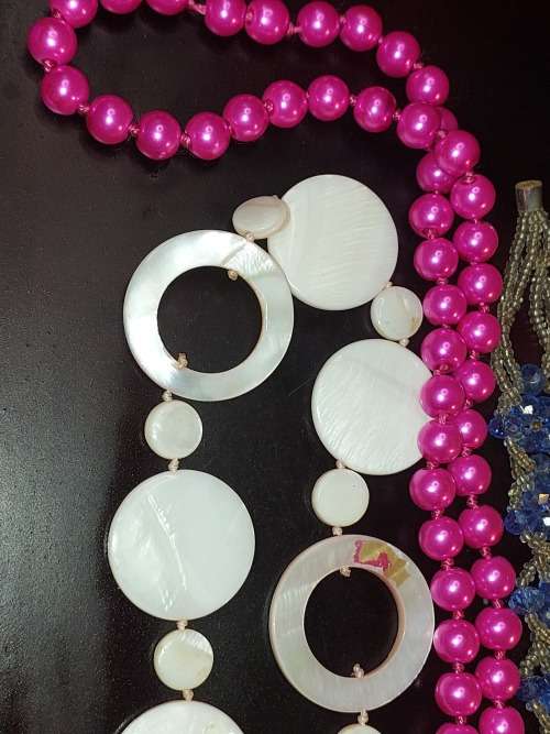 A COLLECTION OF SYNTHETIC BEAD COSTUME NECKLACES