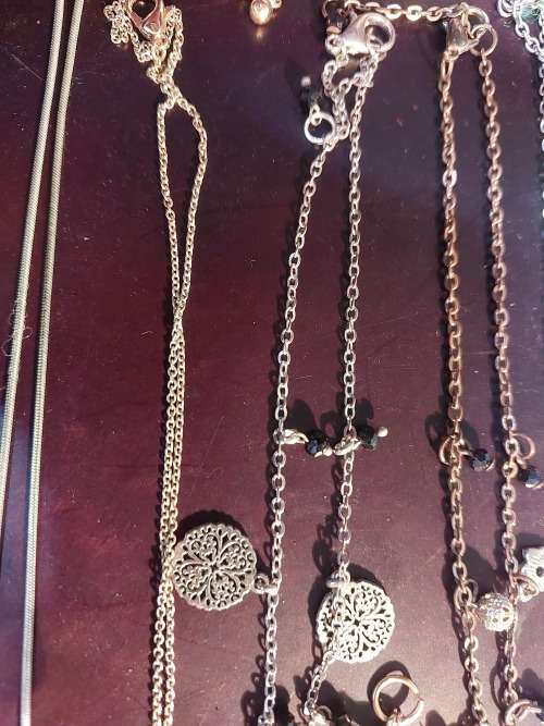 A BULK COLLECTION GOLD PLATED AND SILVER TONE PETIT COSTUME NECKLACES