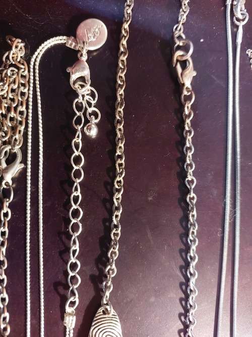 A BULK COLLECTION GOLD PLATED AND SILVER TONE PETIT COSTUME NECKLACES