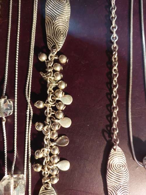 A BULK COLLECTION GOLD PLATED AND SILVER TONE PETIT COSTUME NECKLACES