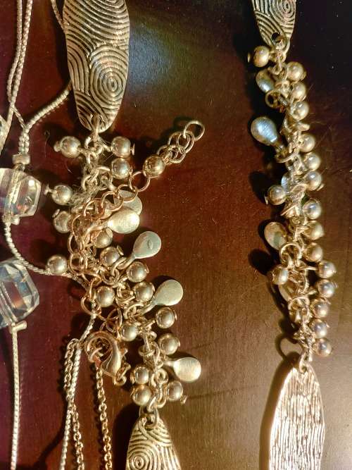 A BULK COLLECTION GOLD PLATED AND SILVER TONE PETIT COSTUME NECKLACES