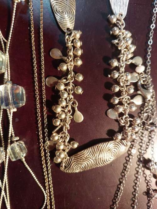A BULK COLLECTION GOLD PLATED AND SILVER TONE PETIT COSTUME NECKLACES
