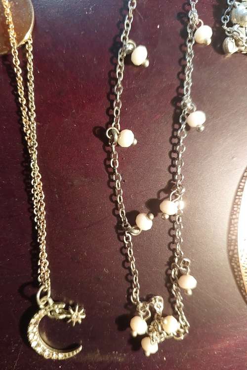 A BULK COLLECTION GOLD PLATED AND SILVER TONE PETIT COSTUME NECKLACES
