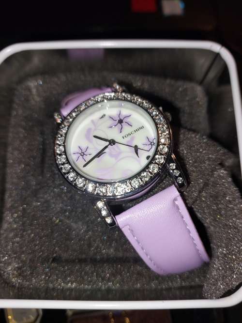A COLLECTION OF DESIGNER DRESS WATCHES SOLD AS IS NOT TESTED