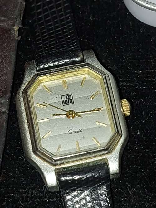 A COLLECTION OF DESIGNER DRESS WATCHES SOLD AS IS NOT TESTED