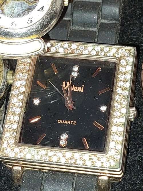 A COLLECTION OF DESIGNER DRESS WATCHES SOLD AS IS NOT TESTED