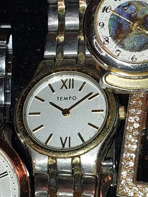 A COLLECTION OF DESIGNER DRESS WATCHES SOLD AS IS NOT TESTED