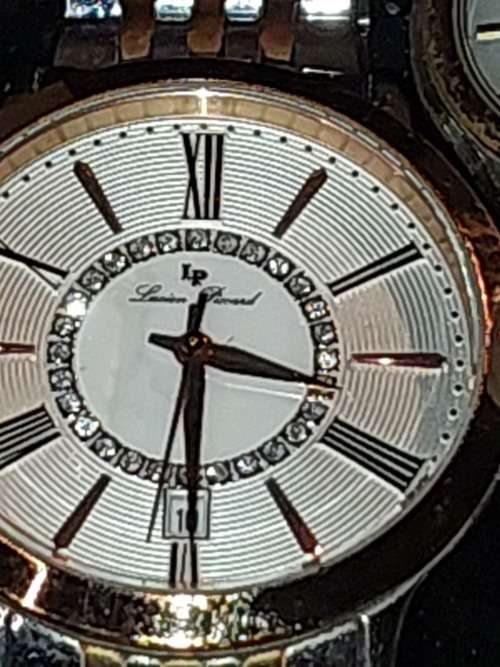 A COLLECTION OF DESIGNER DRESS WATCHES SOLD AS IS NOT TESTED