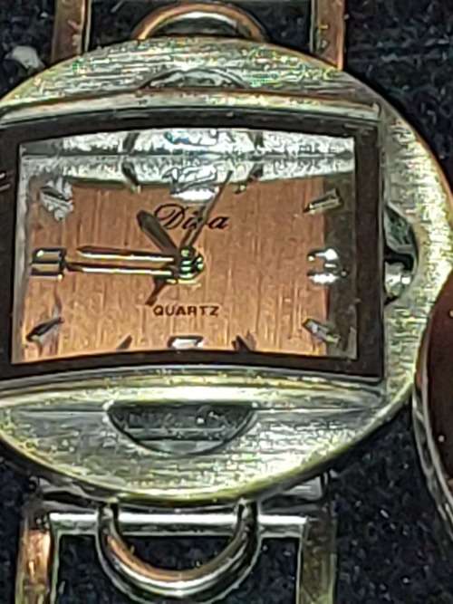 A COLLECTION OF DESIGNER DRESS WATCHES SOLD AS IS NOT TESTED